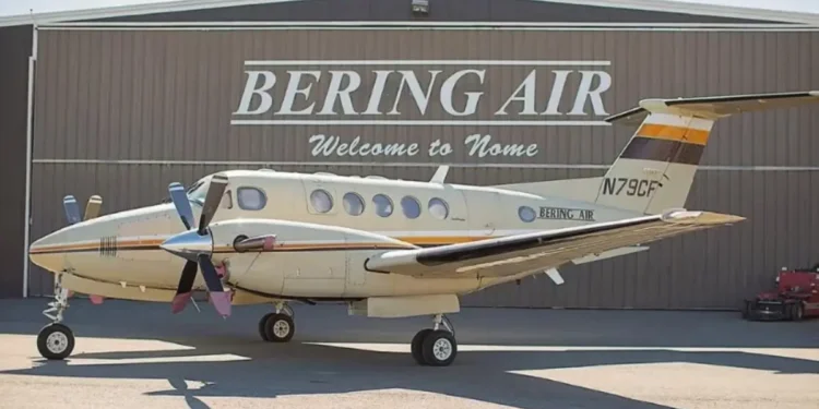 A Bering Air Cessna 208B Grand Caravan parked in front of a hangar with Welcome to Nome signage. The aircraft is similar to the missing Alaska plane carrying 10 people.