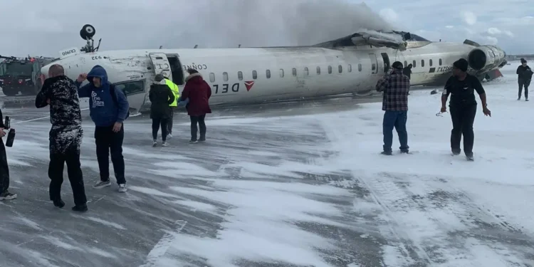 A Delta flight overturned on a snowy runway at Toronto Pearson, with emergency crews responding amid harsh winter conditions.