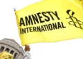 Amnesty International flag raised, highlighting constitutional concerns in Saint Lucia.