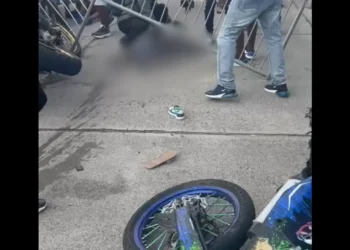 Blurred image of the Vieux Fort Bike Show disaster, where a stunt crash injured several, including a child. (Viewer discretion advised).