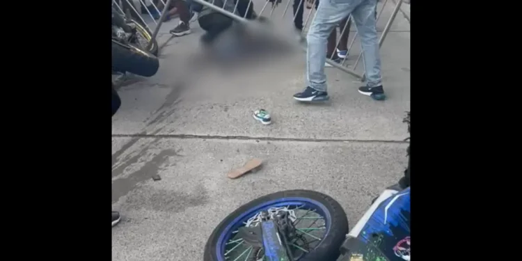 Blurred image of the Vieux Fort Bike Show disaster, where a stunt crash injured several, including a child. (Viewer discretion advised).