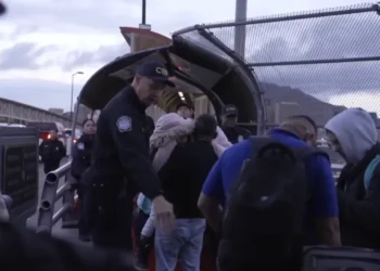 CBP officers process individuals at a border checkpoint as part of the Donald Trump Mass Deportation Plan, highlighting immigration enforcement efforts