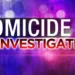 Graphic displaying 'Homicide Investigation' with a blurred police light background, representing the tragic homicide in Grand Riviere.