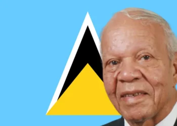 Sir John Compton independence legacy honored with his portrait against the Saint Lucia flag, symbolizing his role in the nation’s sovereignty.