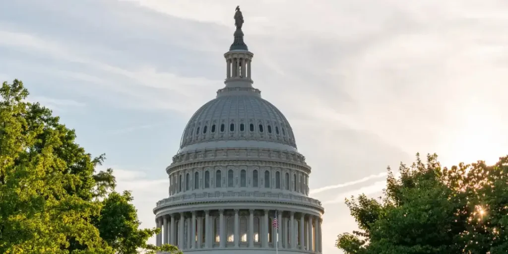 The U.S. Capitol building at sunset, symbolizing government policy changes as the Trump administration mandates alien registration.