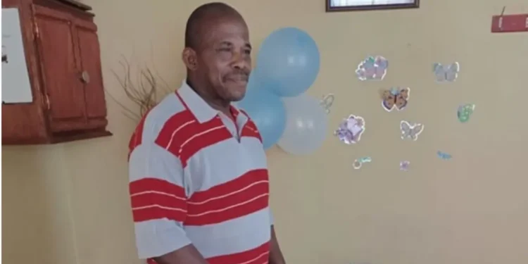 Vernon Labadie, a victim of the Choiseul murder case, standing in a decorated room before succumbing to injuries sustained in the brutal attack.