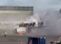 Passengers evacuate onto the wing as an American Airlines plane catches fire at Denver International Airport, with thick smoke filling the air.