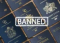 Caribbean passports with a banned stamp, highlighting Trump's crackdown on Caribbean Golden Passports after EU’s 2023 warning.