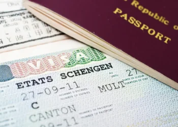 Schengen visa and passport highlighting EU visa-free travel suspension for Caribbean CBI nations