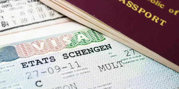 Schengen visa and passport highlighting EU visa-free travel suspension for Caribbean CBI nations