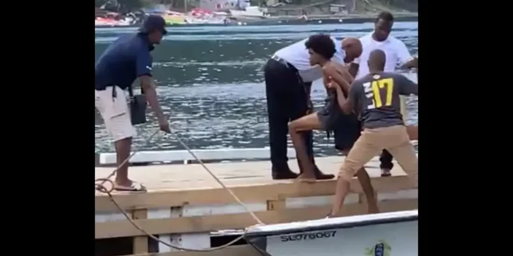 Ken Joseph Ismael suspect arrested and escorted by police at Soufriere dock