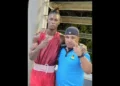 St. Lucian boxer Kyle Marcel celebrates victory with his coach after securing a spot in the 75kg boxing finals at the Caribbean Trophy Tournament.