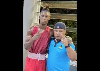 St. Lucian boxer Kyle Marcel celebrates victory with his coach after securing a spot in the 75kg boxing finals at the Caribbean Trophy Tournament.