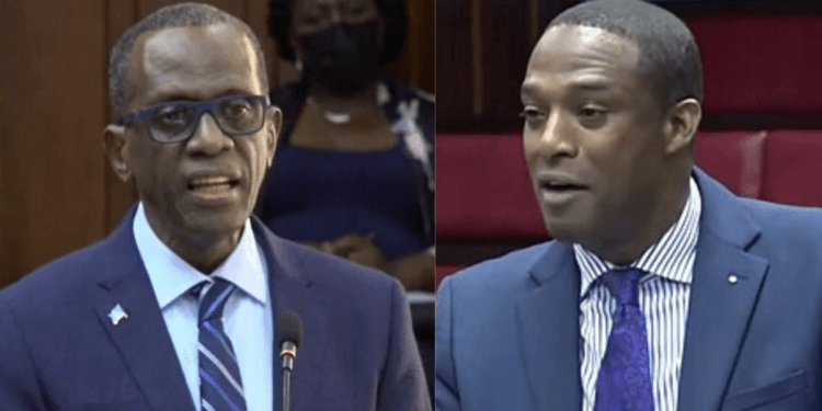 Saint Lucia Prime Minister Philip J. Pierre and Finance Minister Wayne Girard side by side in parliament amid controversy over St Lucia airports foreign control.