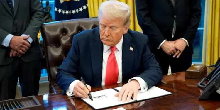 U.S. President Donald Trump signing an executive order in the Oval Office as his new travel ban targets 43 countries, imposing strict immigration restrictions.