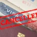 US revokes 300 student visas with a red ‘CANCELLED’ stamp on a US visa, symbolizing a pro-Palestinian crackdown (representational).