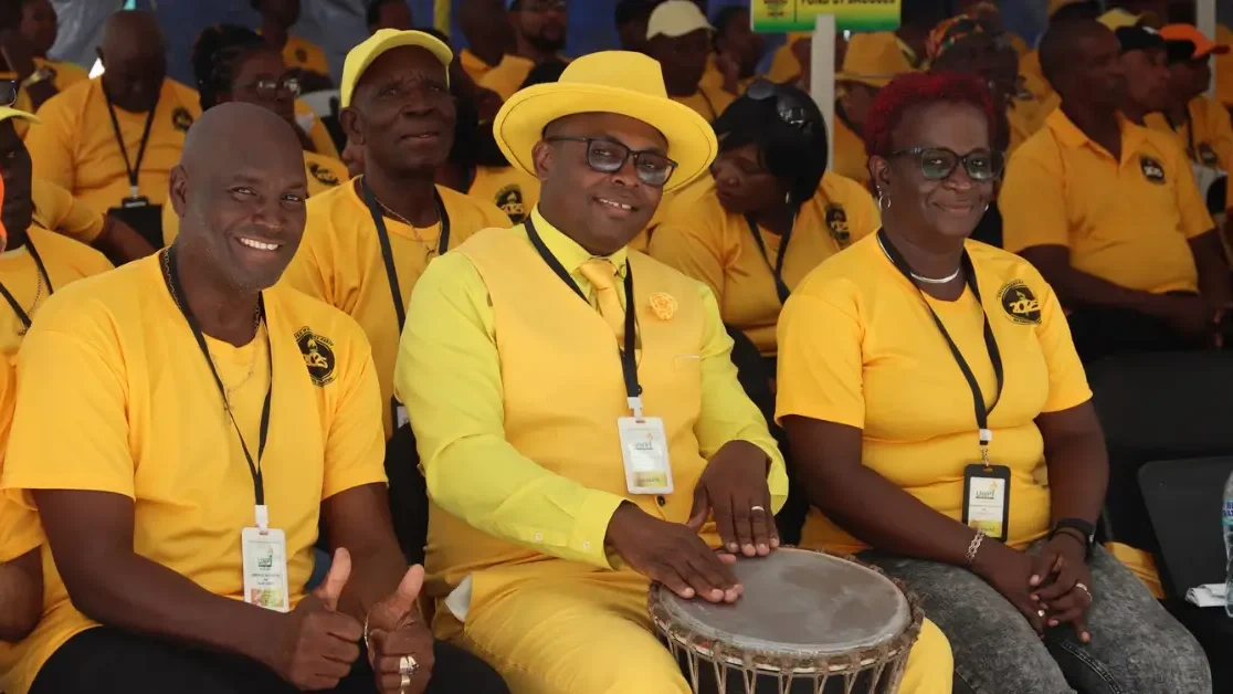 A UWP supporter plays a drum at the UWP Hosts Successful 43rd Convention in St Lucia, highlighting cultural expression and celebration.