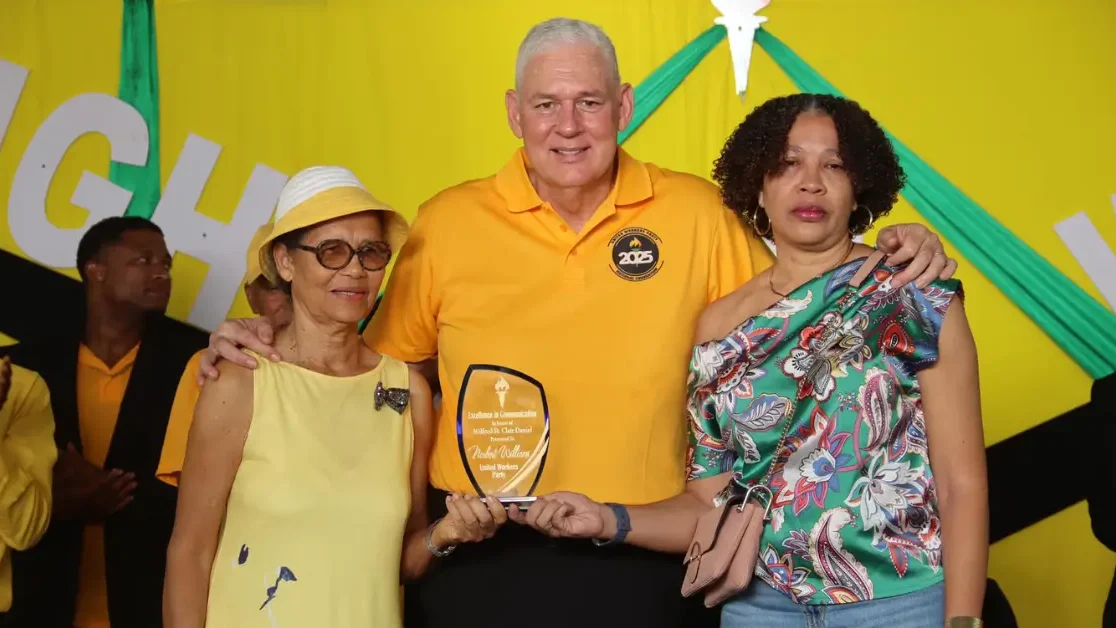 Hon. Allen Chastanet presents the Norbert Williams Excellence in Communication Award to his family at the UWP Hosts Successful 43rd Convention in St Lucia, honoring his legacy.