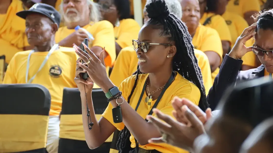 A young UWP supporter captures a key moment at the UWP Hosts Successful 43rd Convention in St Lucia, reflecting strong public engagement and enthusiasm.