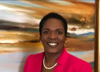 Dr Gemma Chery dies at 47 – St Lucia public health leader in pink blazer smiling