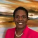 Dr Gemma Chery dies at 47 – St Lucia public health leader in pink blazer smiling