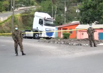 Police officers secure a crime scene in St Lucia amid homicide on the decline in St Lucia.