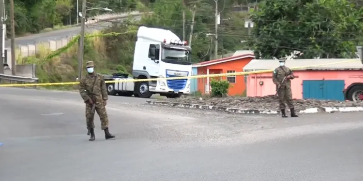 Police officers secure a crime scene in St Lucia amid homicide on the decline in St Lucia.