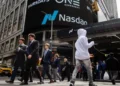Wall Street scene outside Nasdaq as markets react to Trump tariffs recession warning