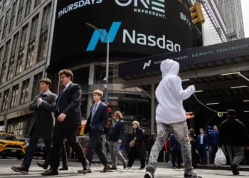 Wall Street scene outside Nasdaq as markets react to Trump tariffs recession warning