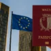 Hand holding a Malta passport in front of the European Court of Justice with the EU flag waving, symbolizing the EU court golden passport ruling.