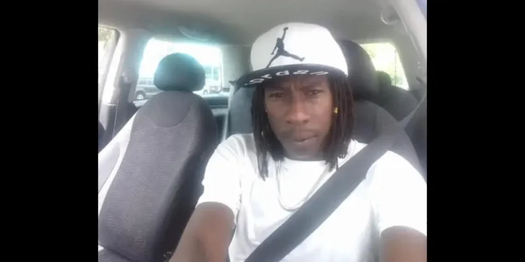 Jeremiah Precius fatally stabbed in Ti Morne, Union on May 11, 2025, seated in a vehicle wearing a white shirt
