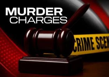 Gavel with crime scene tape in background, symbolizing Loic Augustin charged with murder in Marigot homicide case