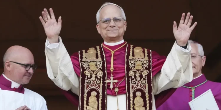 Pope Leo XIV appears on the balcony of St. Peter’s Basilica for his first blessing after being elected as the first American pope