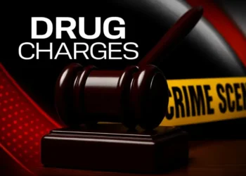 A judge’s gavel with crime scene tape symbolizing drug charges filed against customs employee