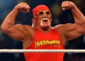 Hulk Hogan flexing in red Hulkamania shirt before crowd – Hulk Hogan dead at 71