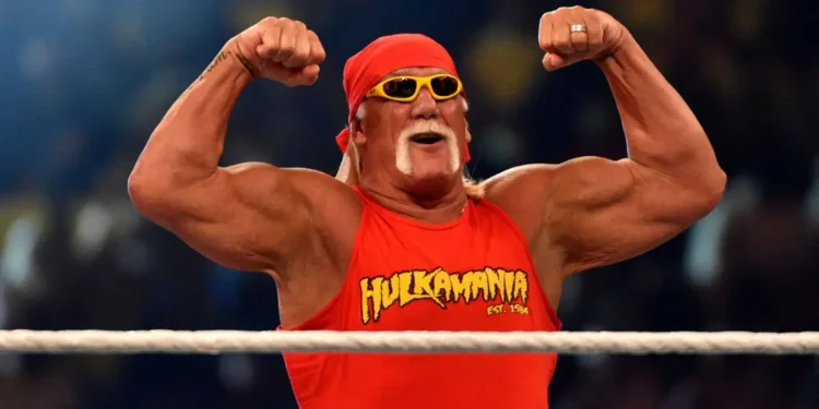 Hulk Hogan flexing in red Hulkamania shirt before crowd – Hulk Hogan dead at 71