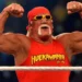 Hulk Hogan flexing in red Hulkamania shirt before crowd – Hulk Hogan dead at 71