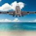 Commercial airplane flying low over Caribbean waters, symbolizing improved Caribbean air connectivity through CTO–ASM partnership