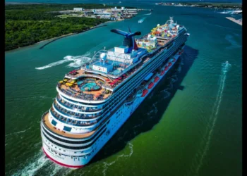 A Carnival Cruise Line ship sailing the Caribbean, as Carnival cuts Costa Maya visits in 2026 and boosts Mahogany Bay itineraries.