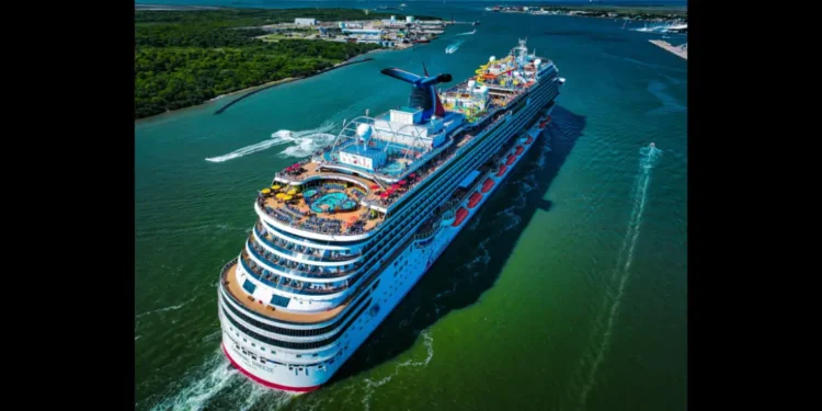 A Carnival Cruise Line ship sailing the Caribbean, as Carnival cuts Costa Maya visits in 2026 and boosts Mahogany Bay itineraries.