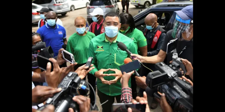 Jamaican Prime Minister Andrew Holness speaks to reporters during the Jamaica general election 2025 campaign
