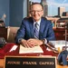 Judge Frank Caprio dies at 88, former Providence Municipal Court chief smiling at his office desk with nameplate and family photos.