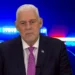 Allen Chastanet addresses the nation on the St Lucia crime crisis with police lights in the background.