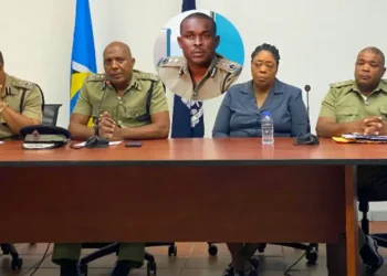Press conference on St Lucia senior cop sexual misconduct case with inset of accused officer.