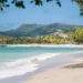 St Lucia weather August 22 2025 showing a Caribbean beach under partly cloudy skies with a tropical wave forecast bringing showers.