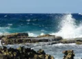 Illustration showing rough seas and crashing waves used to depict marine conditions in the St Lucia weather August 25 2025 forecast.