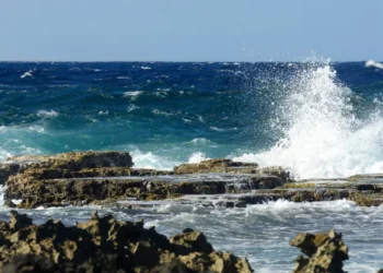 Illustration showing rough seas and crashing waves used to depict marine conditions in the St Lucia weather August 25 2025 forecast.