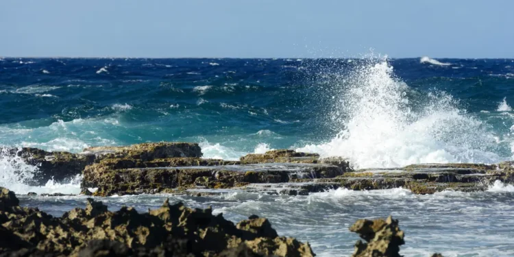 Illustration showing rough seas and crashing waves used to depict marine conditions in the St Lucia weather August 25 2025 forecast.