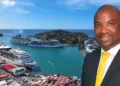 Stephen Fevrier GPH statement: Stephen Fevrier in a suit with a yellow tie, superimposed over Castries harbour with cruise ships docked at Port Castries.