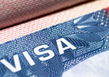 A close-up of a US visa stamp inside a passport, illustrating the US visa bond pilot targeting B-1 and B-2 travelers.